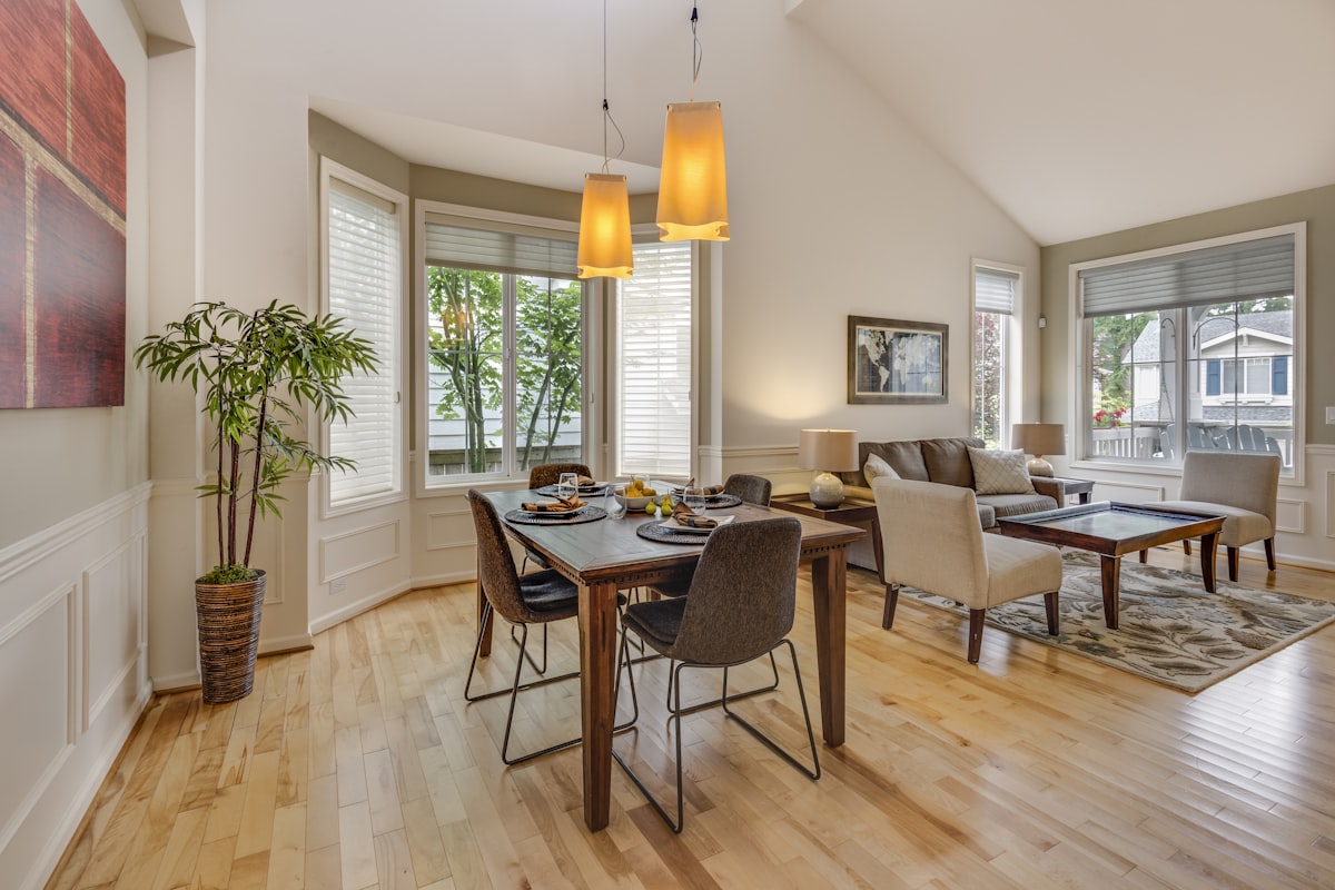 Sunlit dining room with bay windows